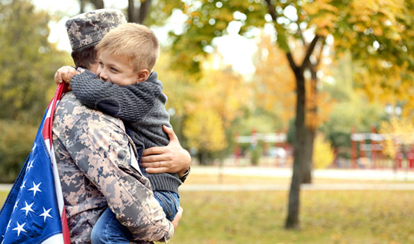 soldier hugging child