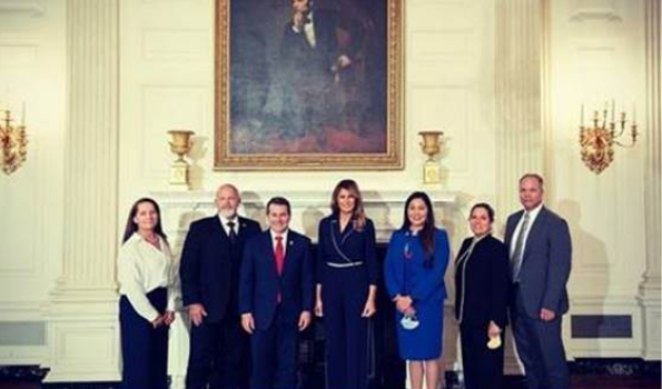 First Lady Melania Trump pictured with members of the Task Force