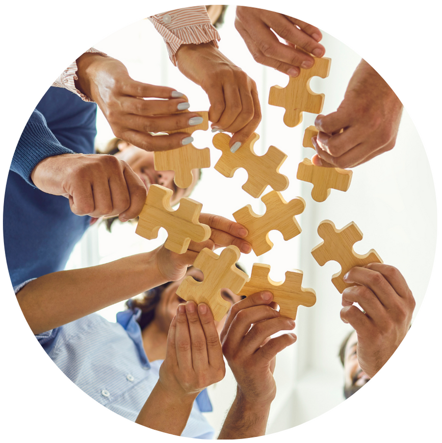 individuals putting puzzle pieces together