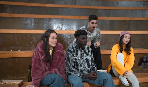 A group of young people sitting on bleachers