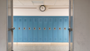 A school hallway with blue lockers.