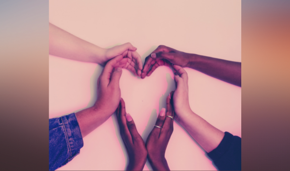 Hands together forming a heart in solidarity