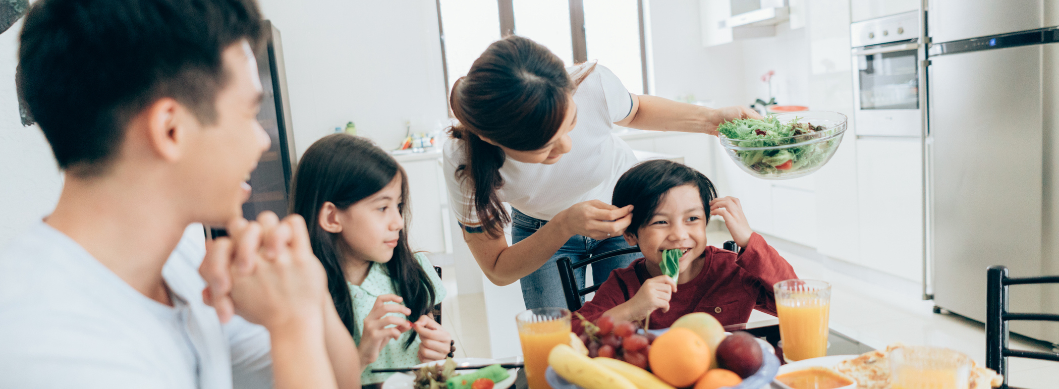 Family convenes around healthy lunch displaying interplay of food and mood