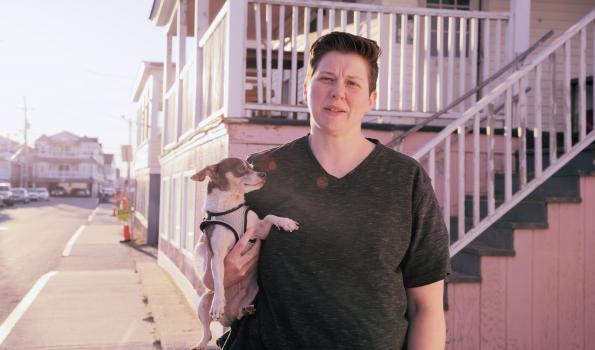 Image of a woman holding a dog