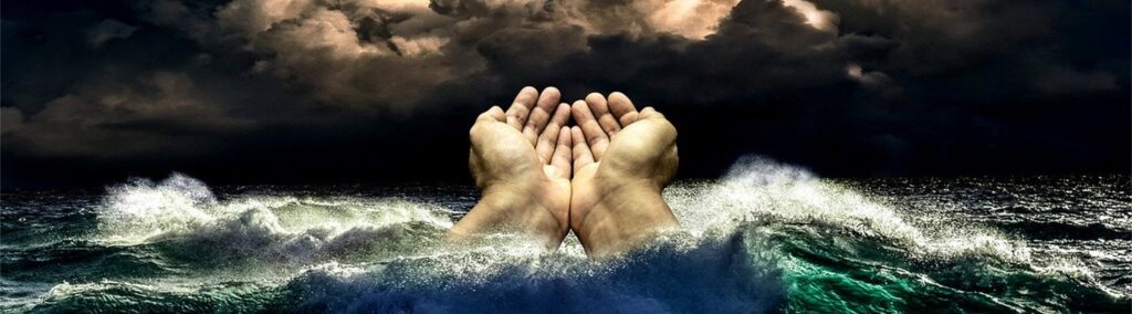 Decorative image banner of hands in an ocean