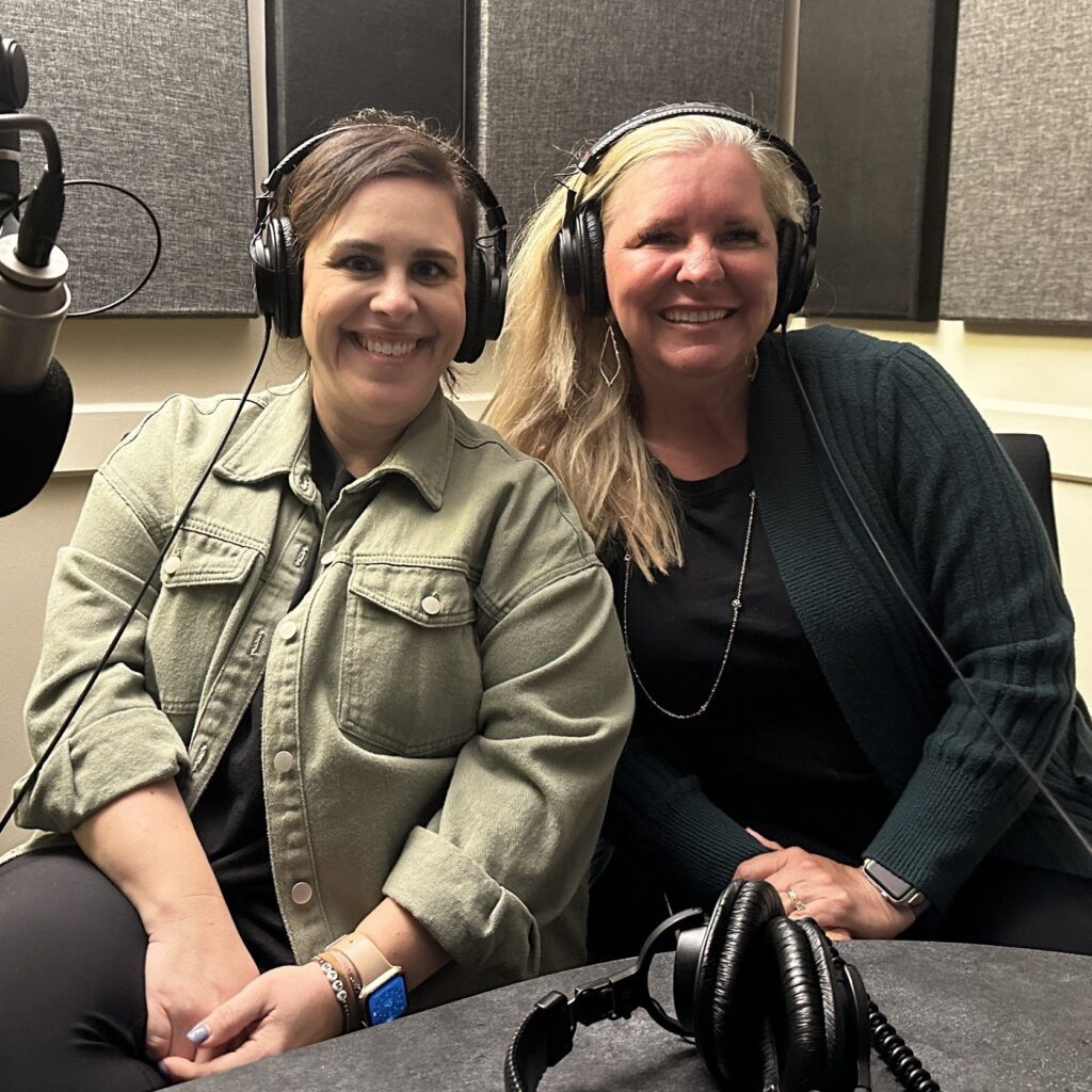 Host Dr. Natalie Fikac sits in a studio with Amanda Boquist 